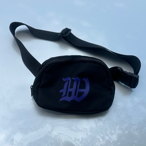 Handbags - NWOT Black Crossbody Bag with Purple Logo
